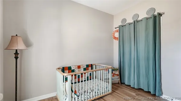 a room with furniture and a baby crib
