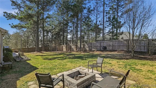 a view of a chairs and table in the patio