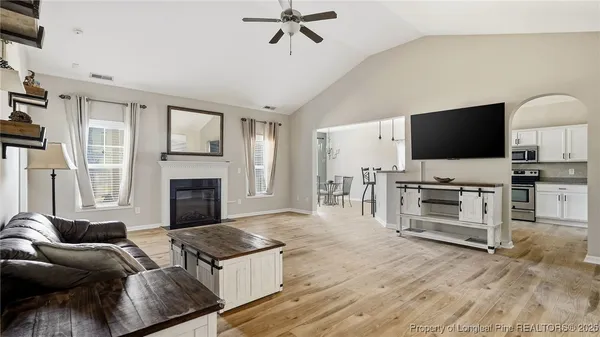 a living room with furniture and a flat screen tv