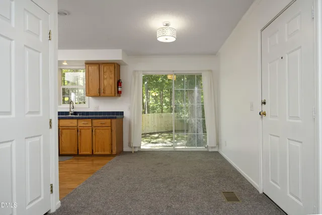 a view of kitchen with wooden floor and window