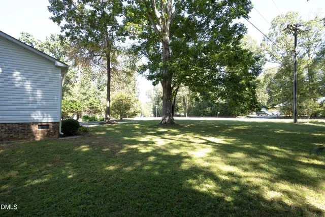 a view of outdoor space with deck and green space