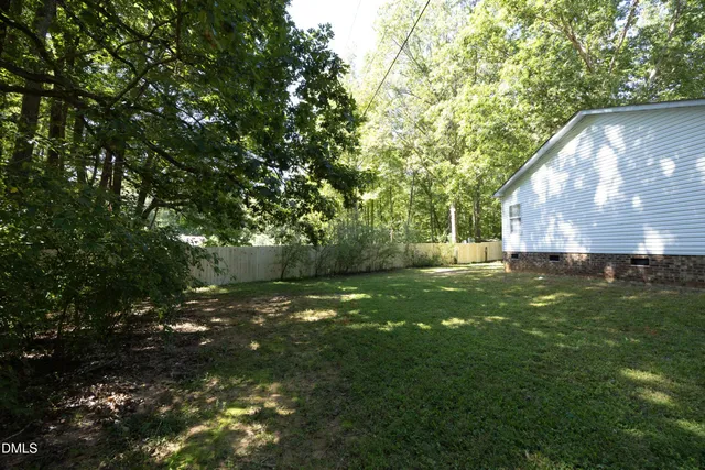 a view of backyard with green space