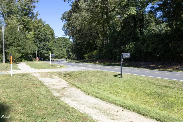 a swimming pool with lots of tress in the background