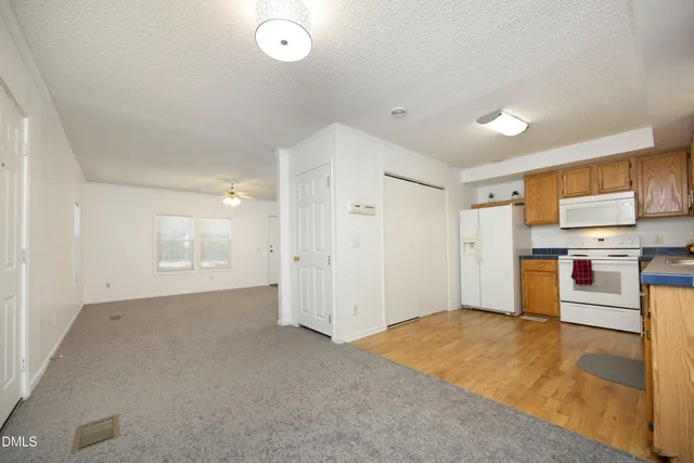 a view of a kitchen with a sink and dishwasher