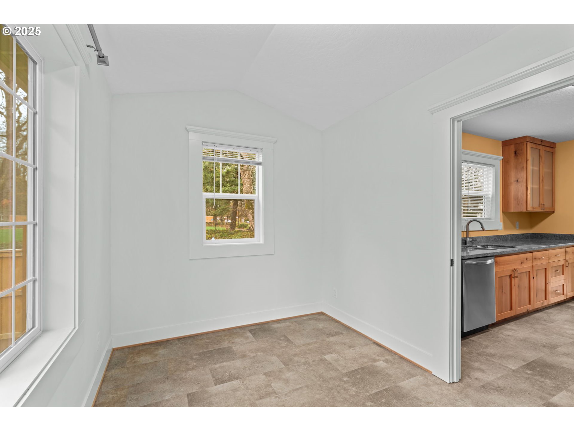 1010 Monroe Street Eugene, OR 97402 - Photo 14 of 40 a room with a window and a kitchen