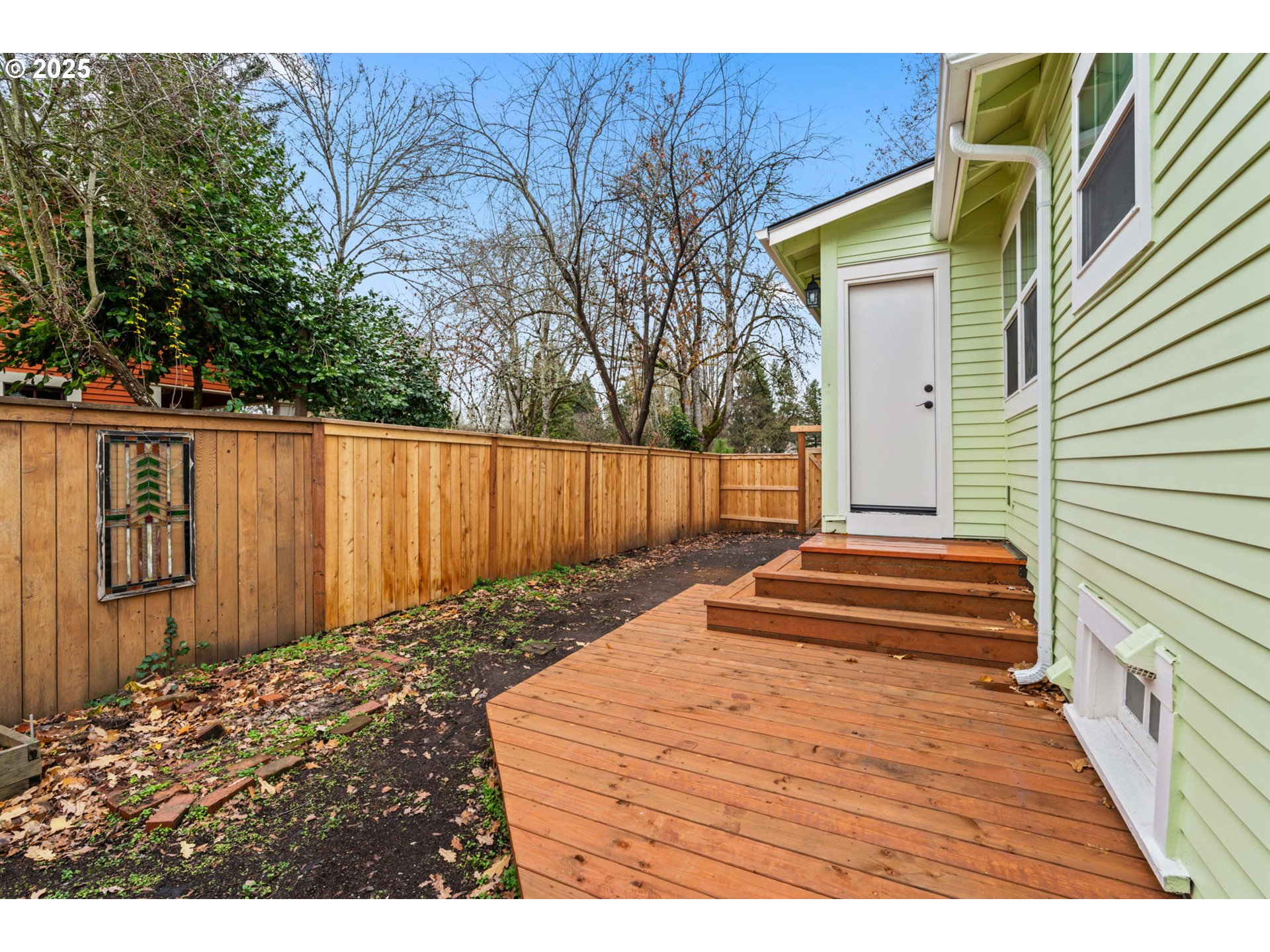 1010 Monroe Street Eugene, OR 97402 - Photo 32 of 40 a view of a backyard with a wooden fence