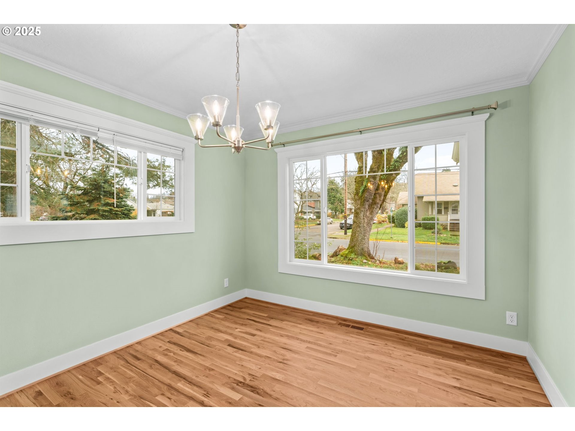 1010 Monroe Street Eugene, OR 97402 - Photo 9 of 40 a view of an empty room with wooden floor and a window