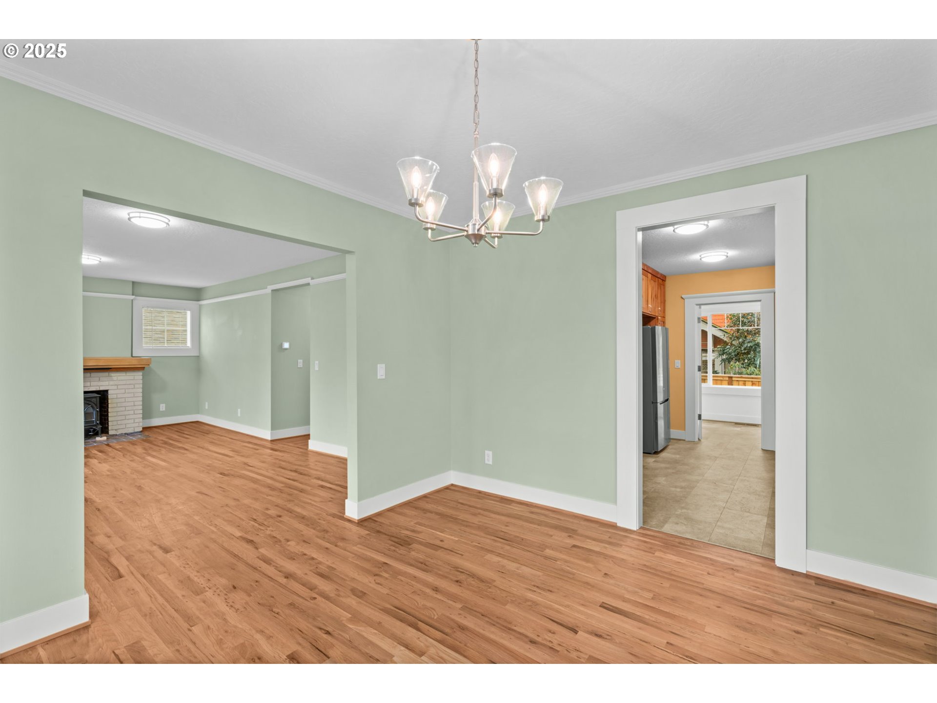 1010 Monroe Street Eugene, OR 97402 - Photo 10 of 40 a view of a chandelier in big room and wooden floor