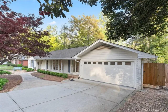 a view of backyard of house with garage