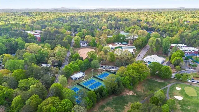 an aerial view of a house with lots of trees