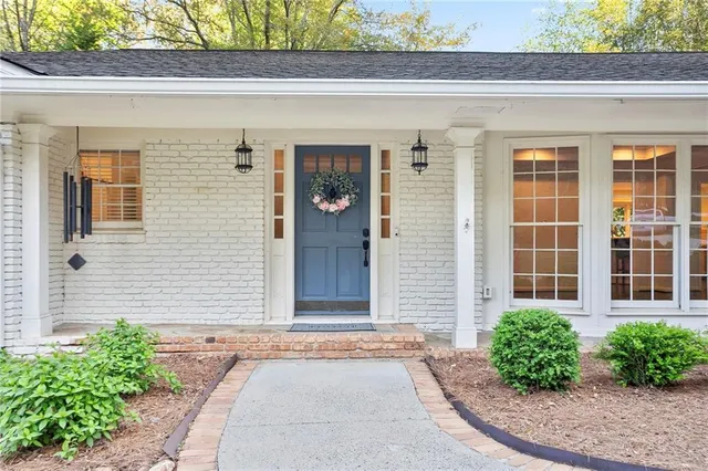 a front view of a house with garden
