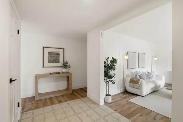 a spacious bedroom with a bed and a couch