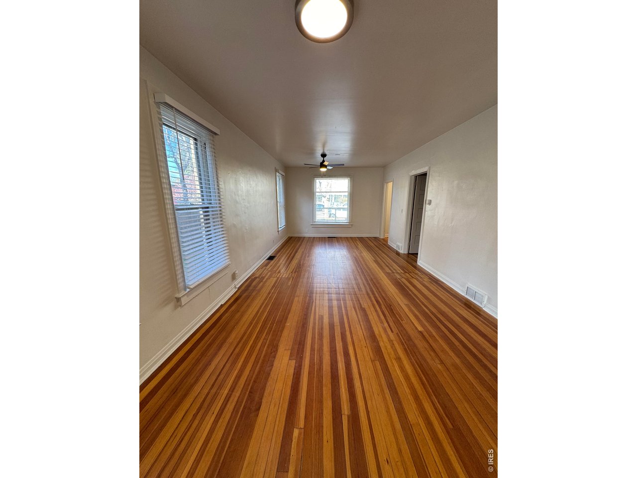 612 South Howes Street Fort Collins, CO 80521 - Photo 4 of 18 a view of a room with wooden floor