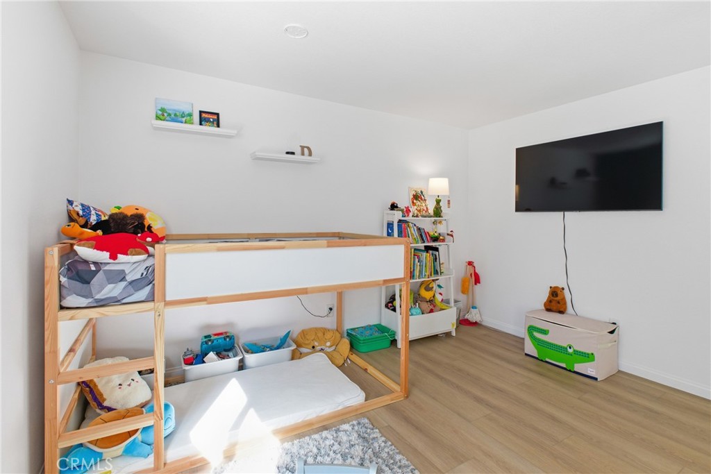20921 Serrano Creek Road, Unit 55 Lake Forest, CA 92630 - Photo 20 of 26 a living room with furniture and a flat screen tv