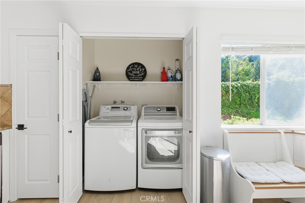 20921 Serrano Creek Road, Unit 55 Lake Forest, CA 92630 - Photo 5 of 26 a utility room with dryer and washer