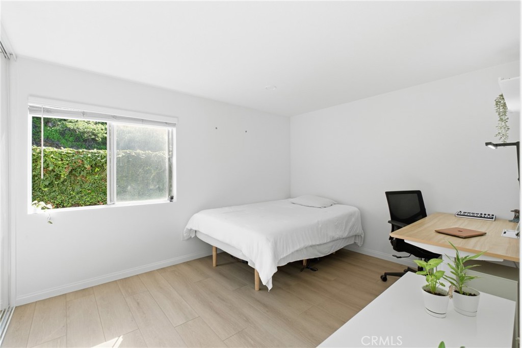 20921 Serrano Creek Road, Unit 55 Lake Forest, CA 92630 - Photo 10 of 26 a bedroom with a bed and a window