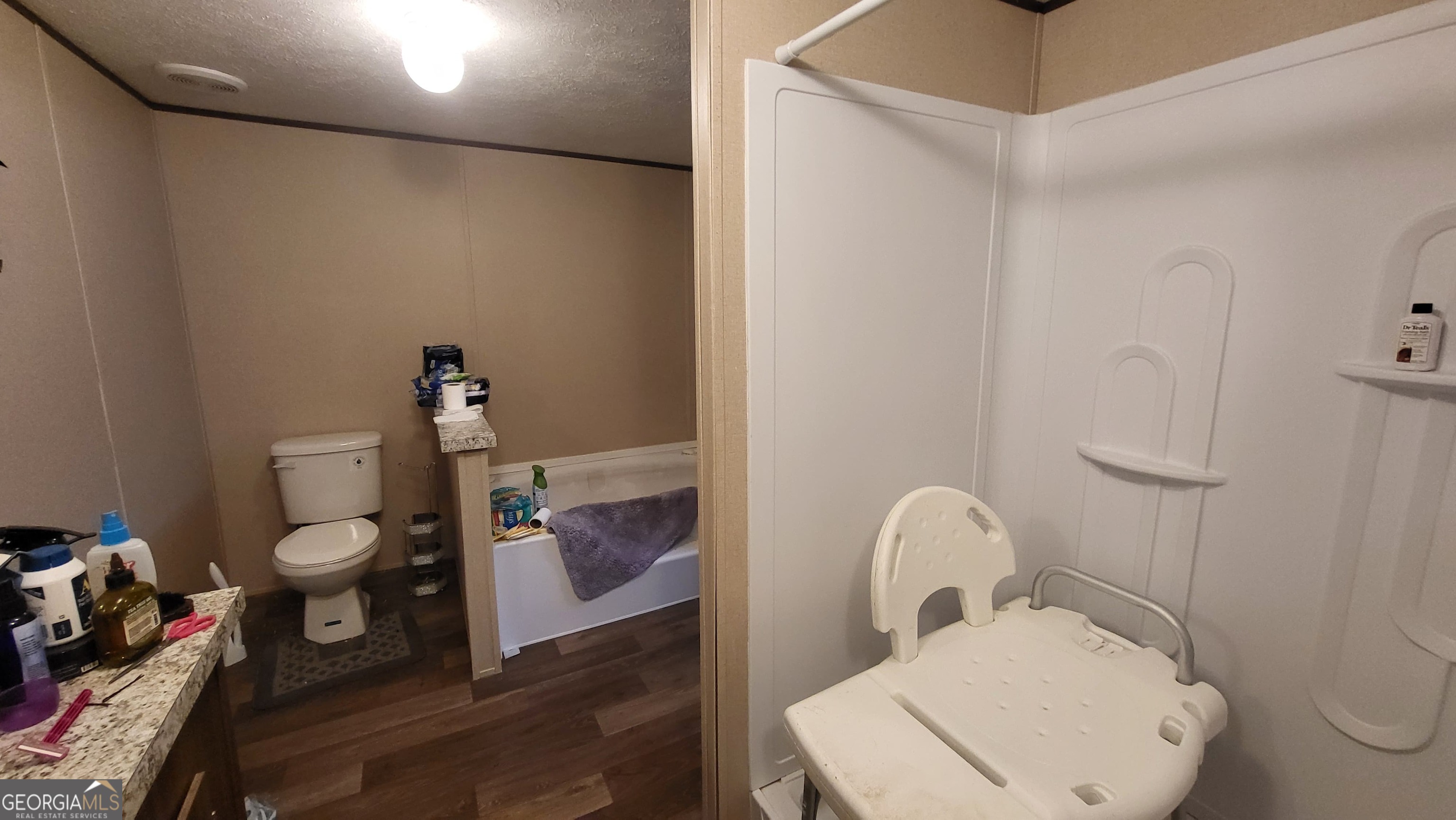 835 Center Of The World Road Canon, GA 30520 - Photo 8 of 9 a bathroom with a toilet and a mirror