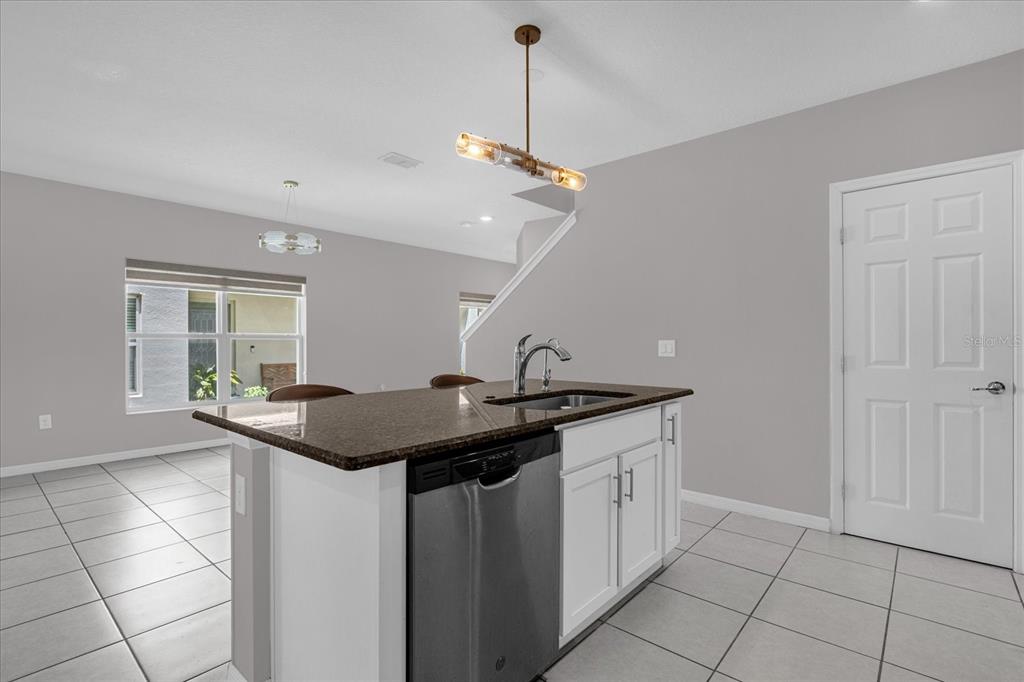 3470 Beau Road Kissimmee, FL 34746 - Photo 13 of 40 a kitchen with a sink and cabinets