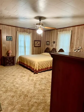 a bedroom with a bed and window