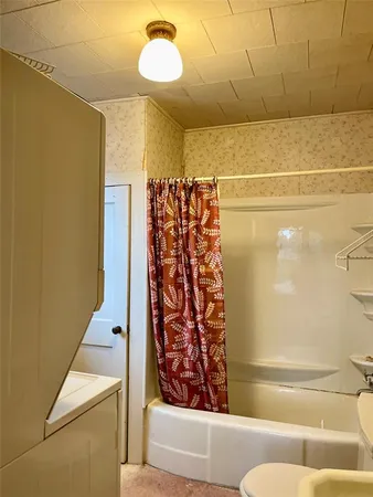a bathroom with a bathtub and shower