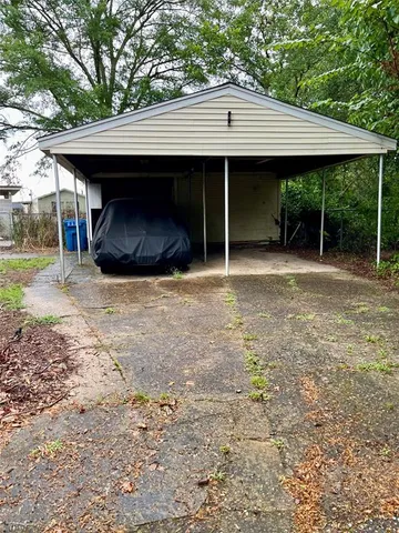 a view of a house with a yard and garage