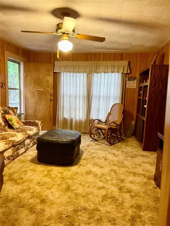 a view of a swimming pool and furniture