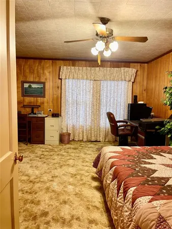 a bed room with a bed and a chandelier