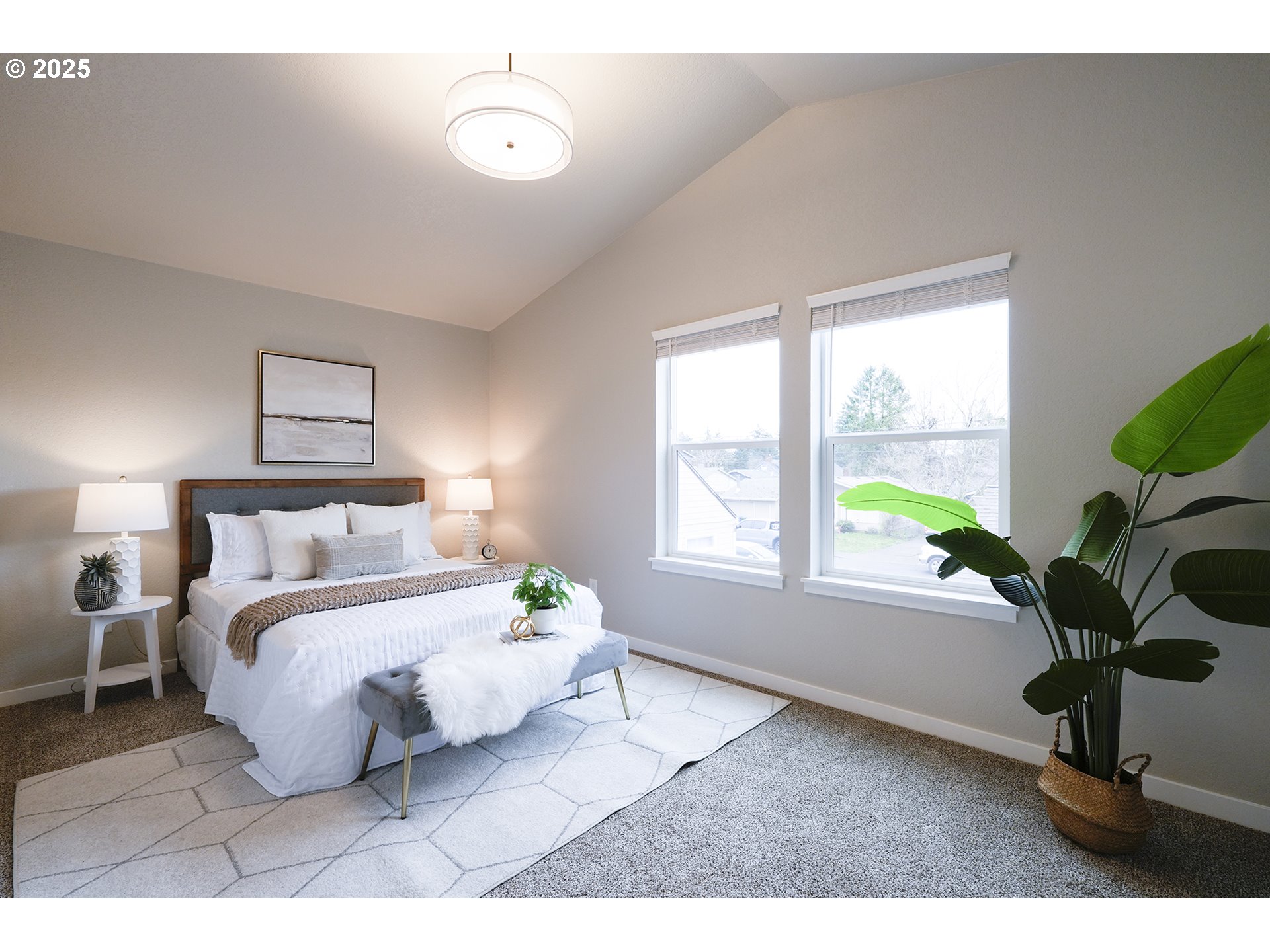 4537 Southeast 97th Avenue Portland, OR 97266 - Photo 15 of 16 a bedroom with a bed lamp and a potted plant
