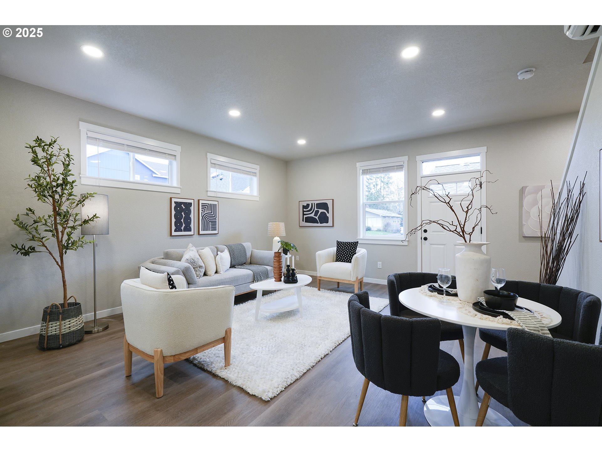 4537 Southeast 97th Avenue Portland, OR 97266 - Photo 6 of 16 a living room with furniture a table and a potted plant