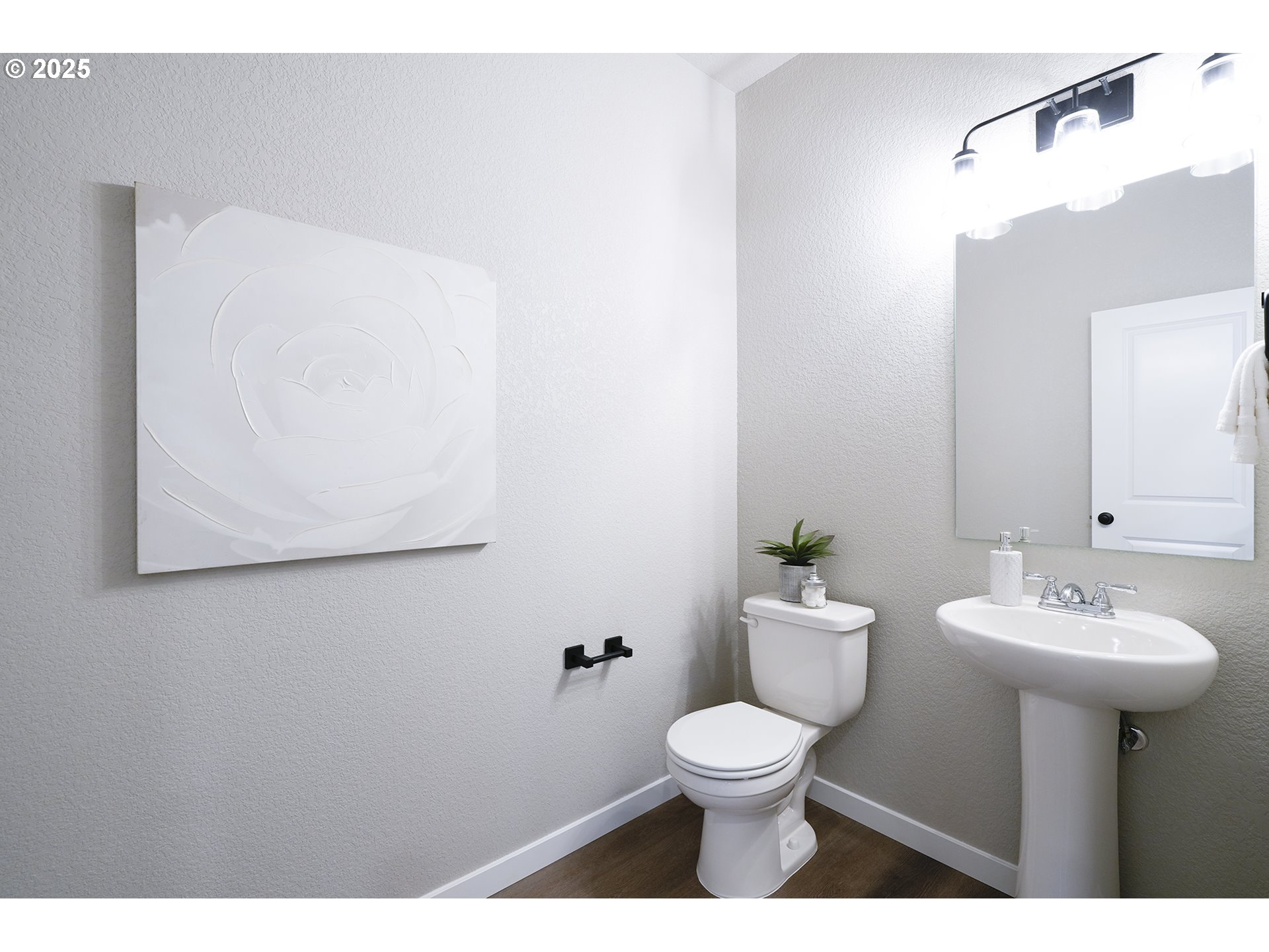 4537 Southeast 97th Avenue Portland, OR 97266 - Photo 10 of 16 a bathroom with a sink mirror and toilet