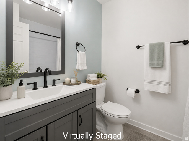 2693 Teal Way Sandy, UT 84093 - Photo 17 of 50 Bathroom featuring a dark gray vanity with a white countertop and integrated sink