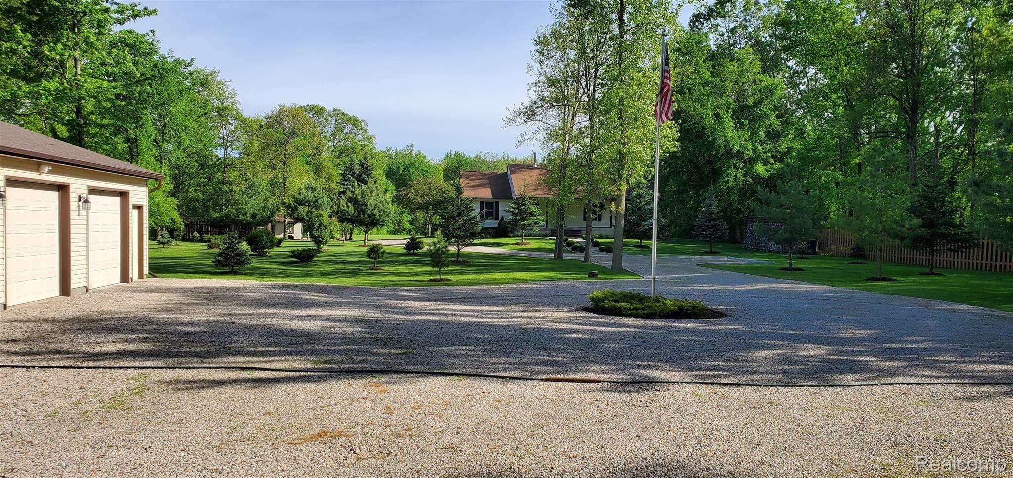 5520 Lowe Road Fowlerville, MI 48836 - Photo 78 of 86 5520 West Lowe Rd View of driveway park like setting