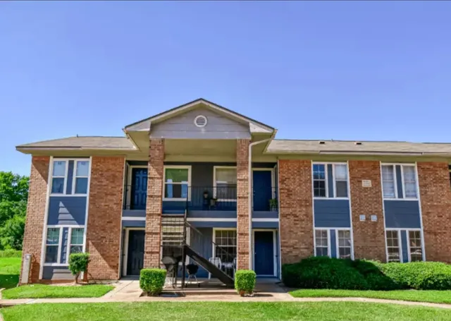a front view of building with yard