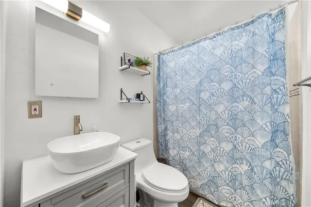 a bathroom with a toilet and a sink