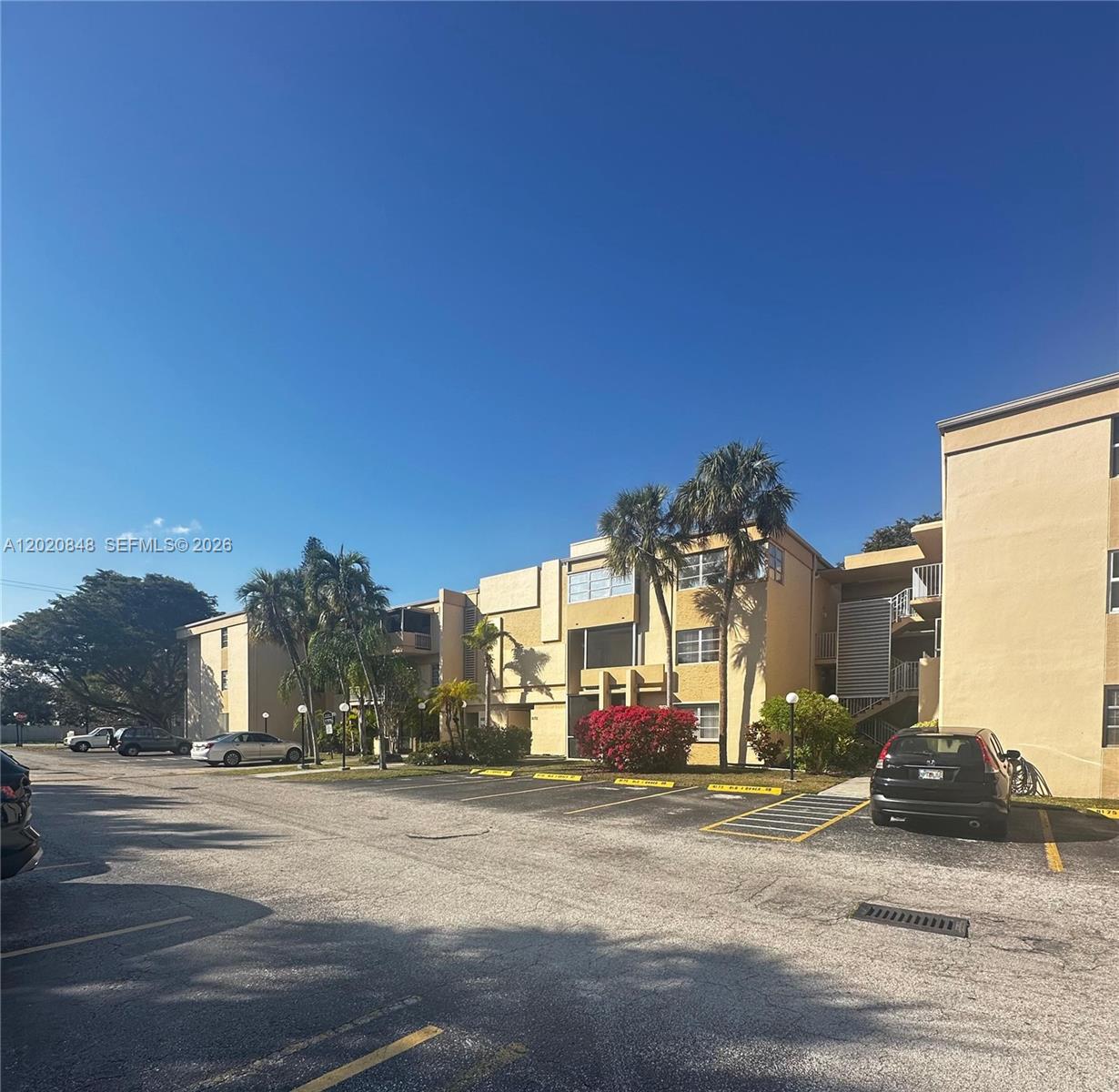 9175 Southwest 77th Avenue, Unit 306 Miami, FL 33156 - Photo 1 of 16 a view of a building and a street