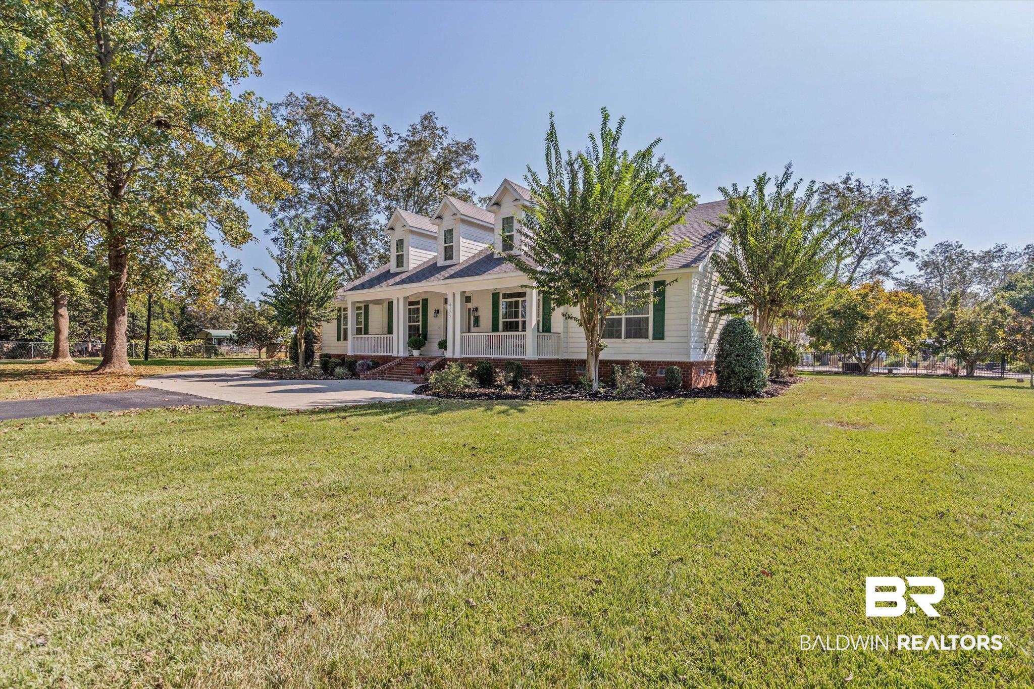 6175 South Grand Bay Wilmer Road Grand Bay, AL 36541 - Photo 35 of 42 Cape cod home featuring covered porch and a front yard