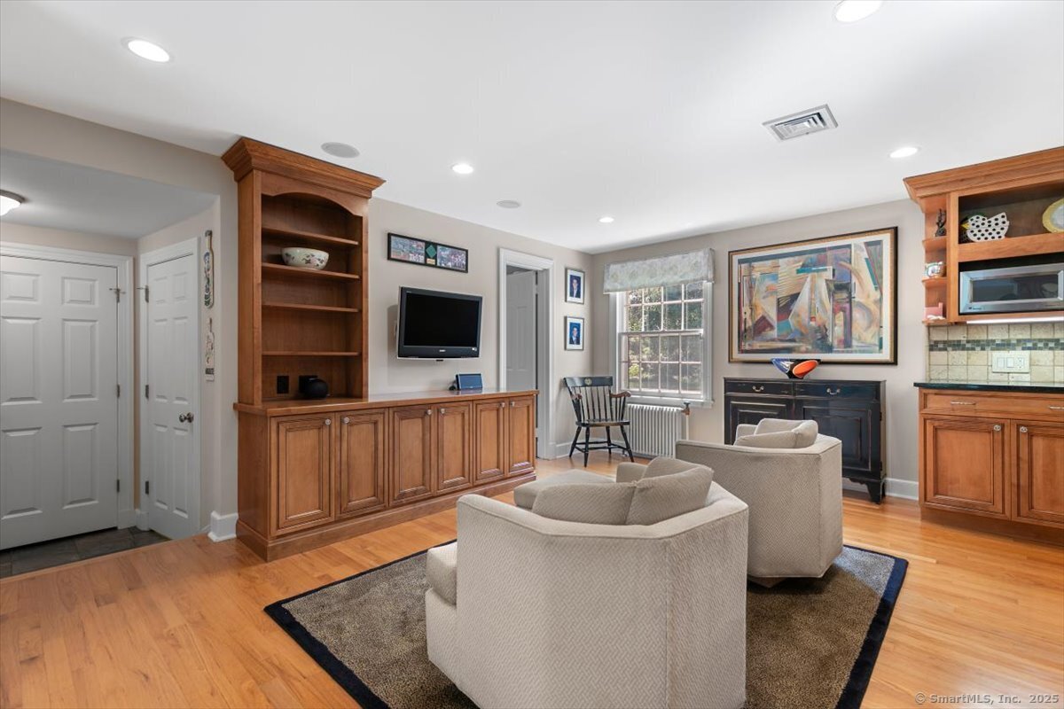 26 Old Orchard Road North Haven, CT 06473 - Photo 18 of 38 a living room with furniture and a flat screen tv