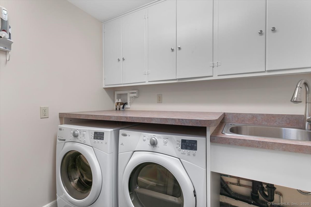 26 Old Orchard Road North Haven, CT 06473 - Photo 21 of 38 a utility room with dryer and washer