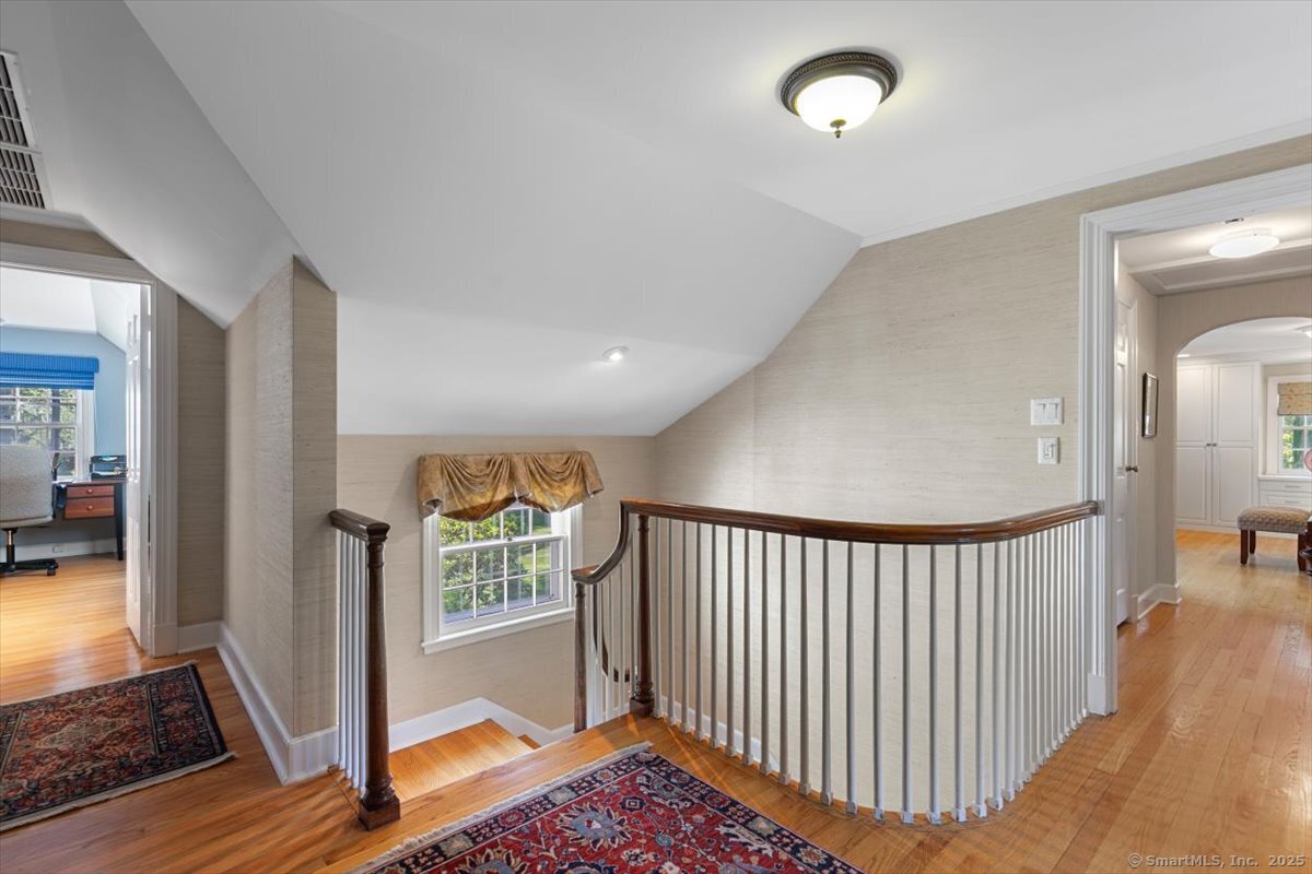 26 Old Orchard Road North Haven, CT 06473 - Photo 22 of 38 a view of a hallway with windows and stairs