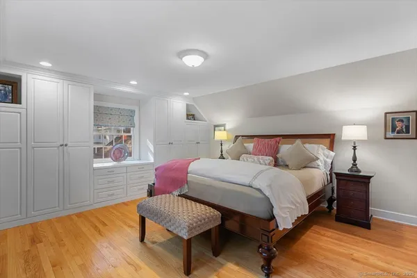 a bedroom with a bed and a couch