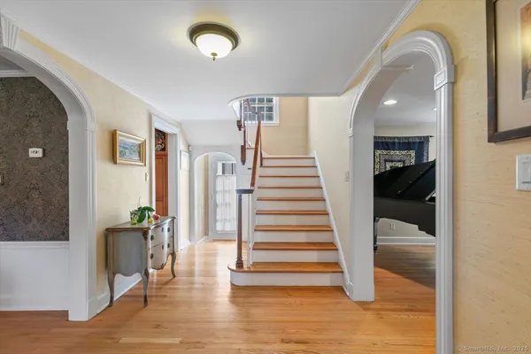 a view of a hallway view with staircase