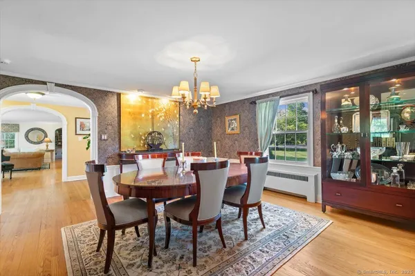 a view of a dining room with furniture window and wooden floor
