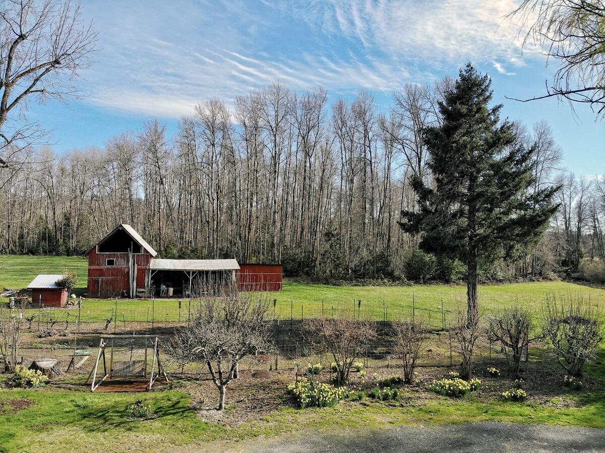3351 Holland Loop Road Cave Junction, OR 97523 - Photo 13 of 48 a front view of a house with garden