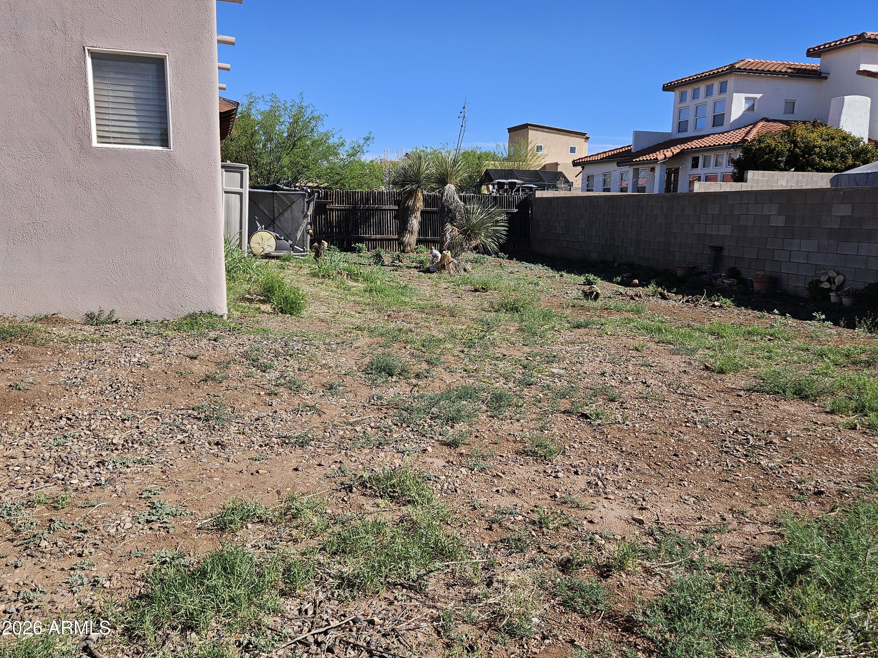 4105 North Washington Avenue Douglas, AZ 85607 - Photo 59 of 61 a view of a chairs and table in the backyard