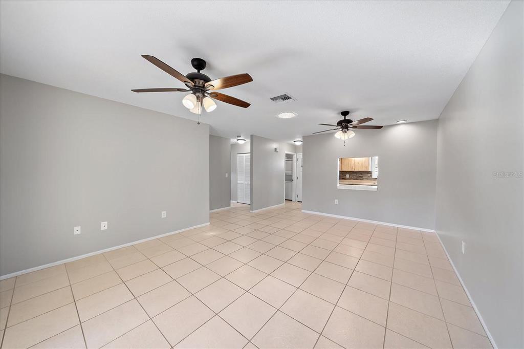1946 Settlement Road, Unit 24 Venice, FL 34285 - Photo 11 of 36 a view of a livingroom with a ceiling fan and window