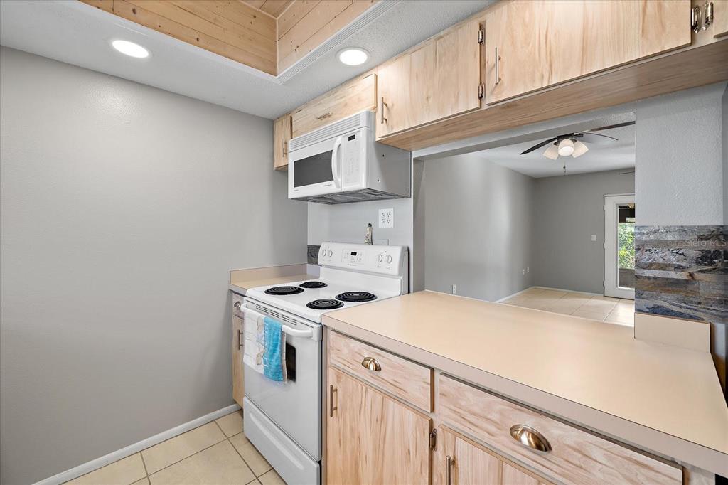 1946 Settlement Road, Unit 24 Venice, FL 34285 - Photo 17 of 36 a kitchen with stainless steel appliances granite countertop a stove and a sink