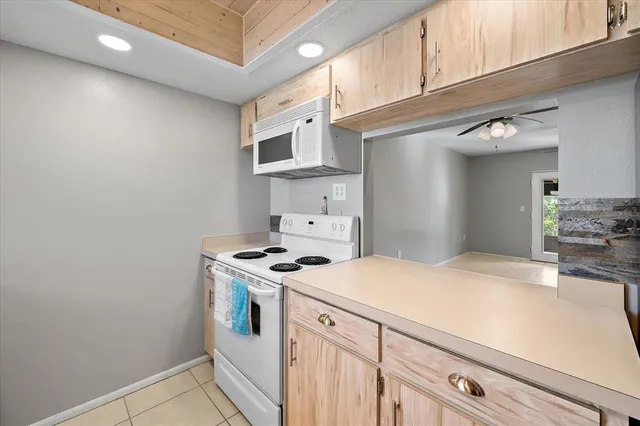 a kitchen with stainless steel appliances granite countertop a stove and a sink