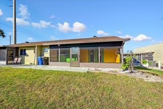 1946 Settlement Road, Unit 24 Venice, FL 34285 - Photo 28 of 51 a front view of a house with a garden and yard