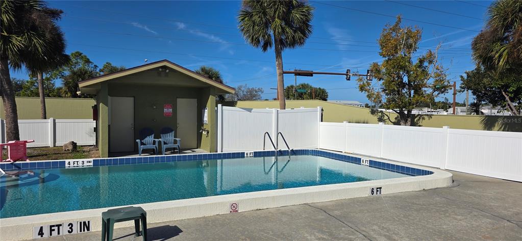 1946 Settlement Road, Unit 24 Venice, FL 34285 - Photo 37 of 51 a view of swimming pool with a yard