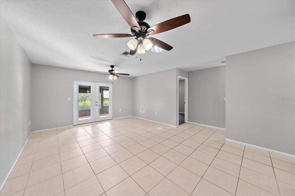 1946 Settlement Road, Unit 24 Venice, FL 34285 - Photo 10 of 36 a view of an empty room and a ceiling fan